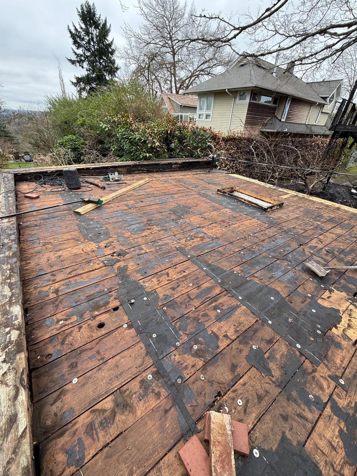 Before - Worn flat roof deck exposed