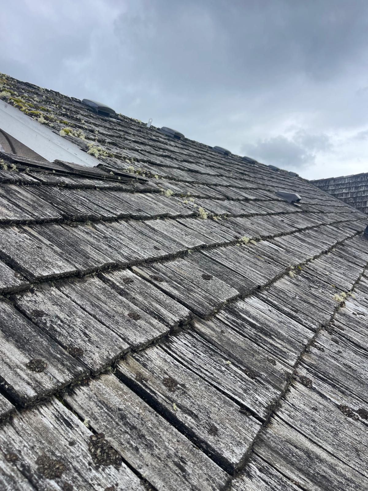 Roofing contractor working on a Renton home - Mass and Mass LLC